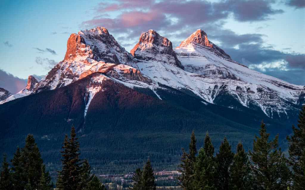 view of three sisters mountain peaks in the snow